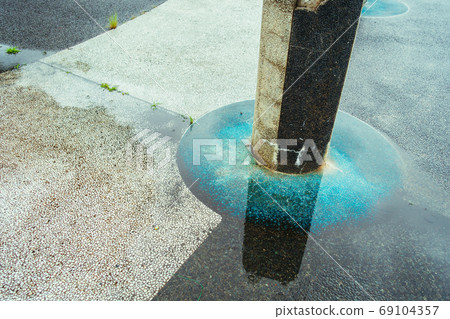 Rain wet concrete ground Rain wet concrete ground 69104357