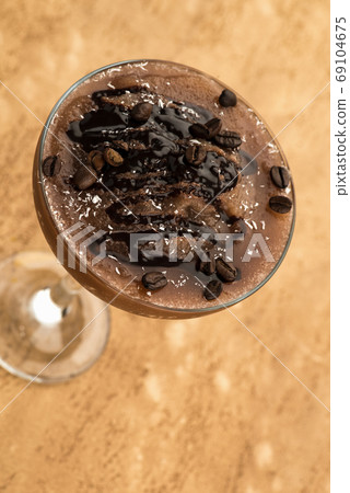 chocolate smoothie on a light brown background 69104675