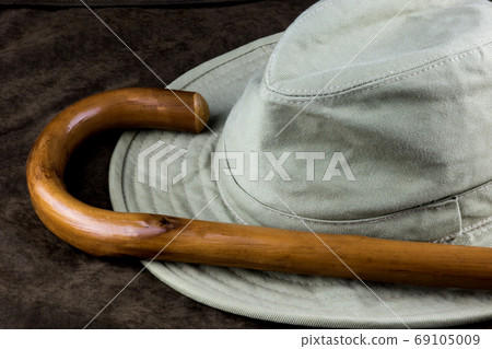 Walking Stick and Hat on Outdoor Coat 69105009