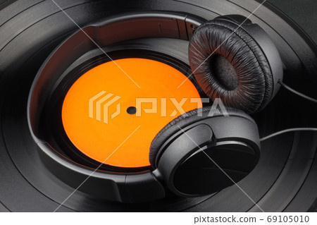 Vinyl Record and Headphones on Black Background 69105010