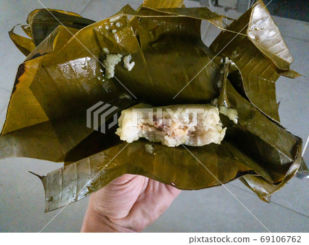 Banh Gio sticky rice filled with pork wrapped in banana leaf Banh Gio sticky rice filled with pork wrapped in banana leaf 69106762