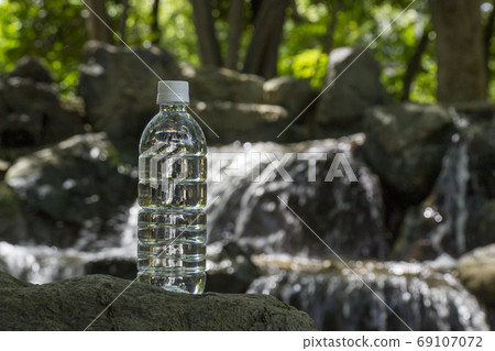 Clear stream and plastic bottle 69107072