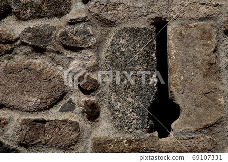 Stone Castle Wall With Arrow Slit Close Up Stone Castle Wall With Arrow Slit Close Up 69107331