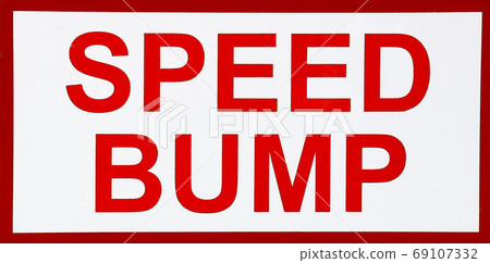 Speed Bump Sign on an Urban Street Speed Bump Sign on an Urban Street 69107332