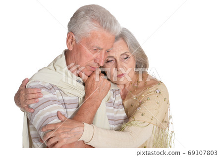 Close up portrait of sad senior couple 69107803