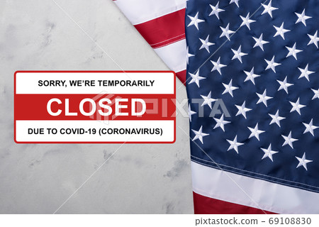 USA Flag of United States of America with sign closed due to Coronavirus Covid-19 sign USA Flag of United States of America with sign closed due to Coronavirus Covid-19 sign 69108830