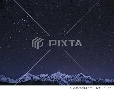 Deqin Meili Snow Mountains, Yunnan, China and stars over Mt. Meili, China 69108956