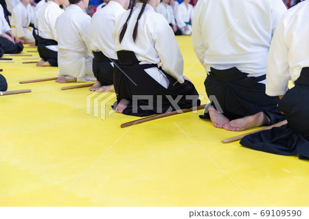 People in kimono on martial arts weapon training seminar People in kimono on martial arts weapon training seminar 69109590