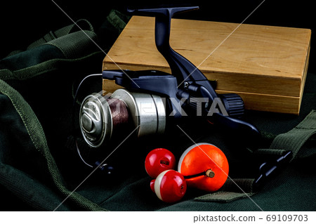 Fishing Reel with Floats and Tackle Box on Fishing Bag Fishing Reel with Floats and Tackle Box on Fishing Bag 69109703