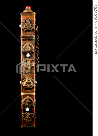 Buddhist Incense Holder Isolated on a Black Background Buddhist Incense Holder Isolated on a Black Background 69109705
