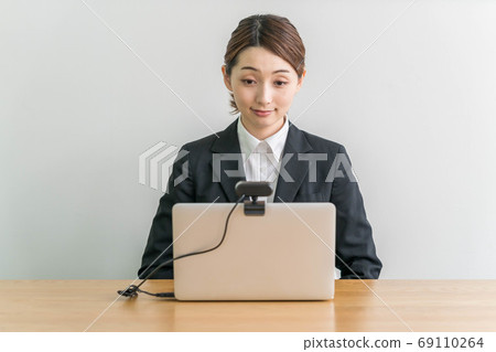 Young woman interviewing online using a webcam 69110264
