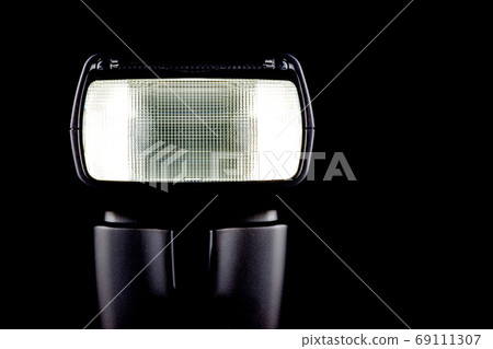 Electronic Flashgun Close Up View on a Black Background 69111307