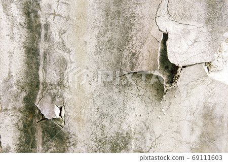 texture of a shabby wall. stone texture with holes with scratches, cracks and peeling paint 69111603