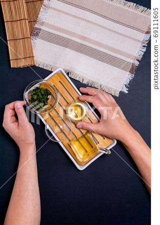 tea ceremony, on a black background top view vertical photo flat lay 69111605