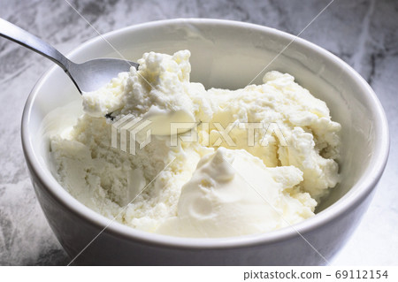 Spoon of vanilla ice cream. Seletive focus. Spoon of vanilla ice cream. Seletive focus. 69112154