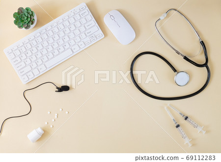 Doctor`s online consultation and remote medical communication concept. Keyboard, stethoscope, microphone Doctor`s online consultation and remote medical communication concept. Keyboard, stethoscope, microphone 69112283