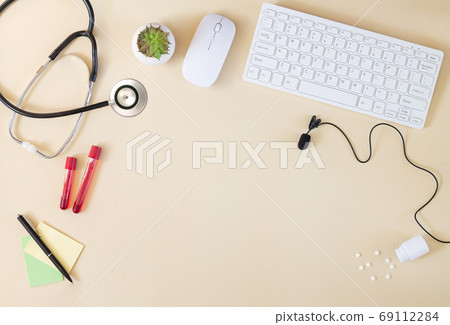 Doctor`s online consultation concept with computer and microphone 69112284