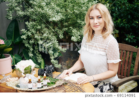 Woman writing business plan 69114091