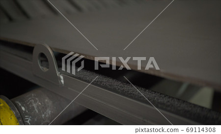 Metal plant. Conveyor at a metallurgical plant. 69114308