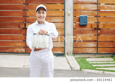 Milkman offering fresh milk 69114461
