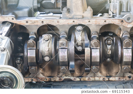 Engine crankshaft in engine block with old engine oil dirty cover. Repair , Maintenance Engine crankshaft in engine block with old engine oil dirty cover. Repair , Maintenance 69115343
