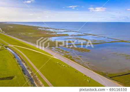 Aerial view sea dike Waddensea Aerial view sea dike Waddensea 69116330