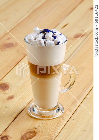 Latte macchiato in tall transparent glass Latte macchiato in tall transparent glass 69116422