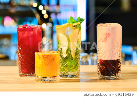 Classic cold cocktails - rum and cola, mojito and clover club Classic cold cocktails - rum and cola, mojito and clover club 69116429