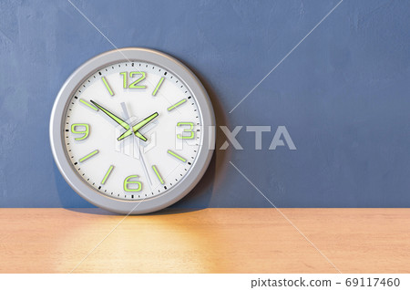 Wall clock on the wooden table. 3D rendering Wall clock on the wooden table. 3D rendering 69117460