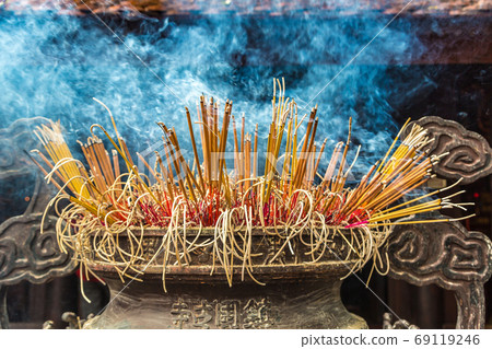 Burning incense sticks 69119246