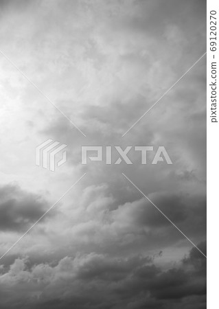 Cloudscape, overcast grey clouds over horizon. Cloudy gray sky background. 69120270