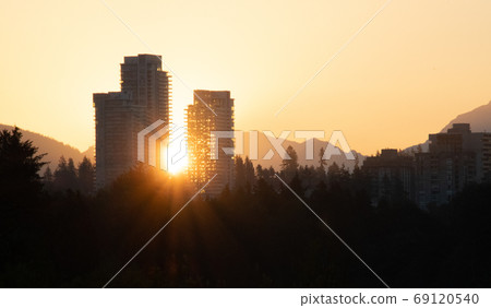 The sun rising during high rise Bank-Bar British Columbia Canada 69120540