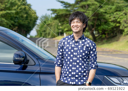 A man enjoying a drive by buying a new car A man enjoying a drive by buying a new car 69121922