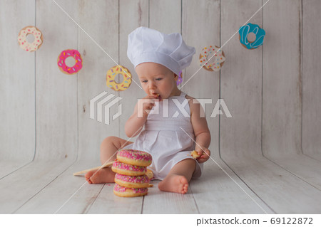 One year old baby girl celebrates her birthday. One year old baby girl celebrates her birthday. 69122872