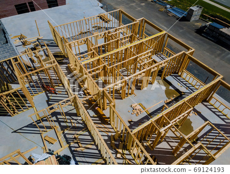 Wooden house frame structure on a new development 69124193