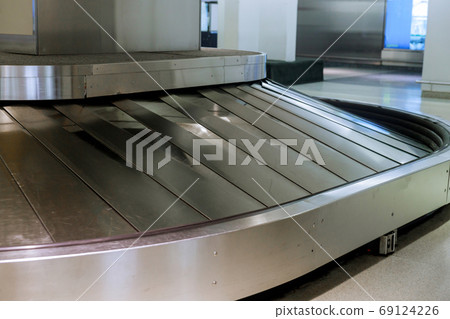 Empty baggage claim area at check in desk at 69124226