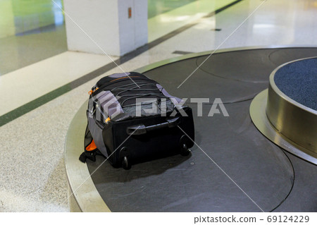 Suitcase or luggage with conveyor belt on baggage Suitcase or luggage with conveyor belt on baggage 69124229