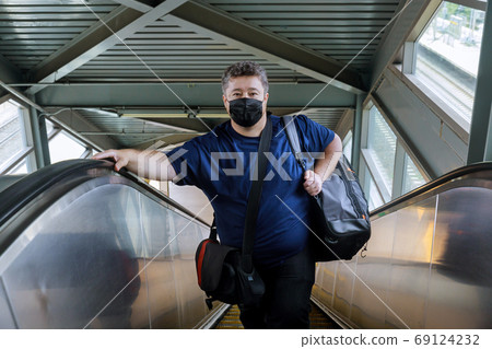 Man wear surgical face mask for protecting Man wear surgical face mask for protecting 69124232