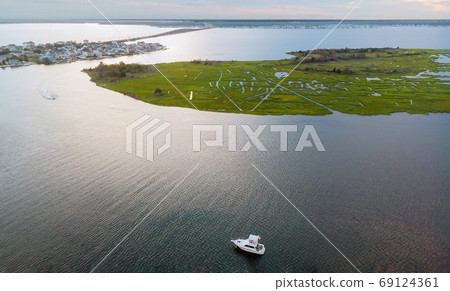 Small coastal town in area view from hill to sea 69124361