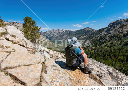 Photographer taking picture of the beautiful landscape around th 69125612