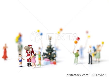 Miniature people : Santa Claus holding gift for happy family , Christmas and Happy New Year concept. 69125646