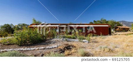 Sunny view of a beautiful house Sunny view of a beautiful house 69125705