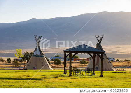 Morning view of the Native American Indian Tents Teepee 69125833