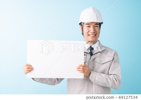 Businessman with whiteboard work clothes 69127534