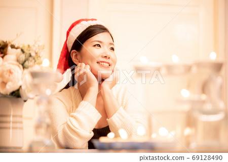 Christmas image Santa hat woman Christmas image Santa hat woman 69128490