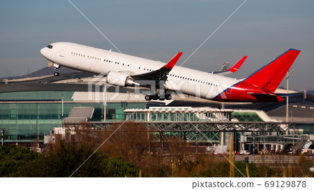 Take off passenger plane in the sky. Airport Barcelona Take off passenger plane in the sky. Airport Barcelona 69129878