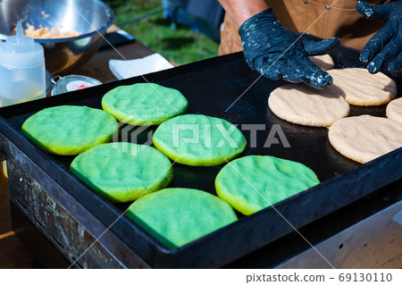 Arepas from corn meal, Venezuelan traditional fast street food Arepas from corn meal, Venezuelan traditional fast street food 69130110