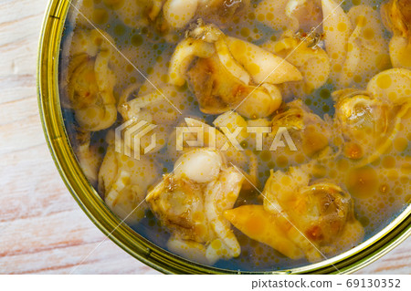 Open tin can with white clams closeup Open tin can with white clams closeup 69130352