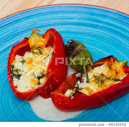 Appetizer sweet red peppers stuffed with soft cheese brynza Appetizer sweet red peppers stuffed with soft cheese brynza 69130354