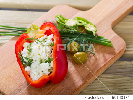 Pepper stuffed with brynza is tasty dish of Bulgarian cuisine Pepper stuffed with brynza is tasty dish of Bulgarian cuisine 69130375